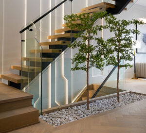 Open-concept interior Toronto with floating staircase, large windows, and natural light