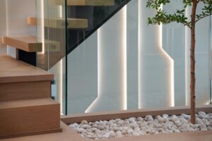 Modern staircase Toronto with floating wood treads and integrated vertical LED wall lighting