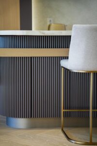 Custom bar cabinetry Toronto with fluted wood panels and integrated storage